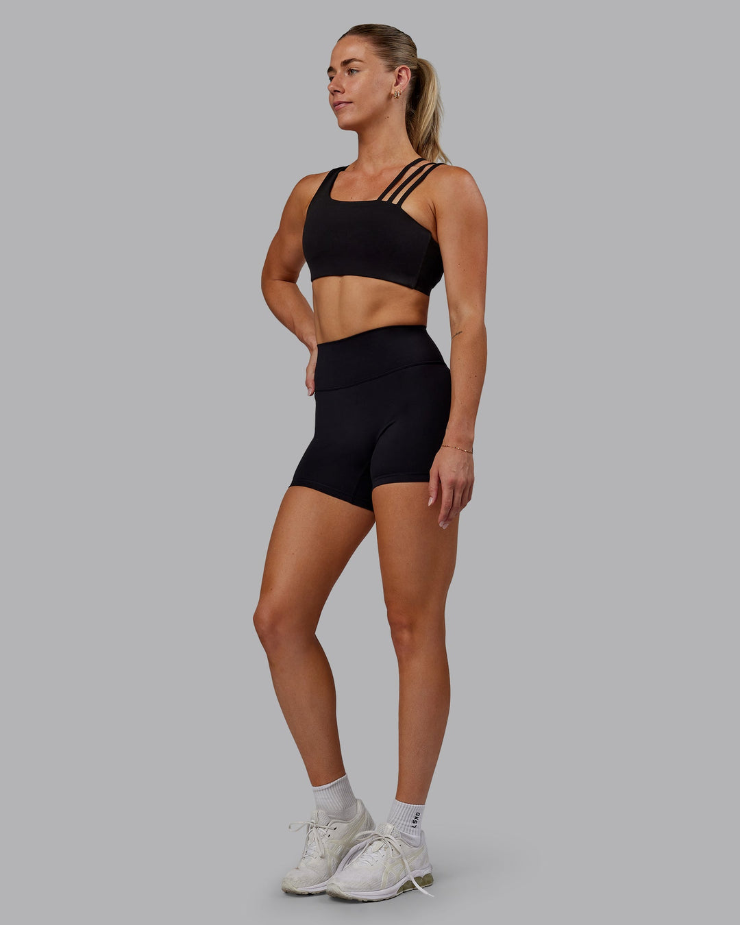 Woman wearing Fusion Ultra High-Rise 4" Short - Black | Model:Hannah | Size:S