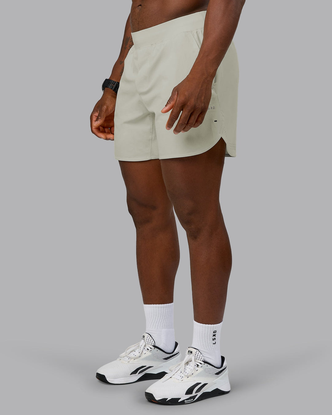 Man wearing Lift 6" Performance Short - Bone | Model:Sam | Size:L
