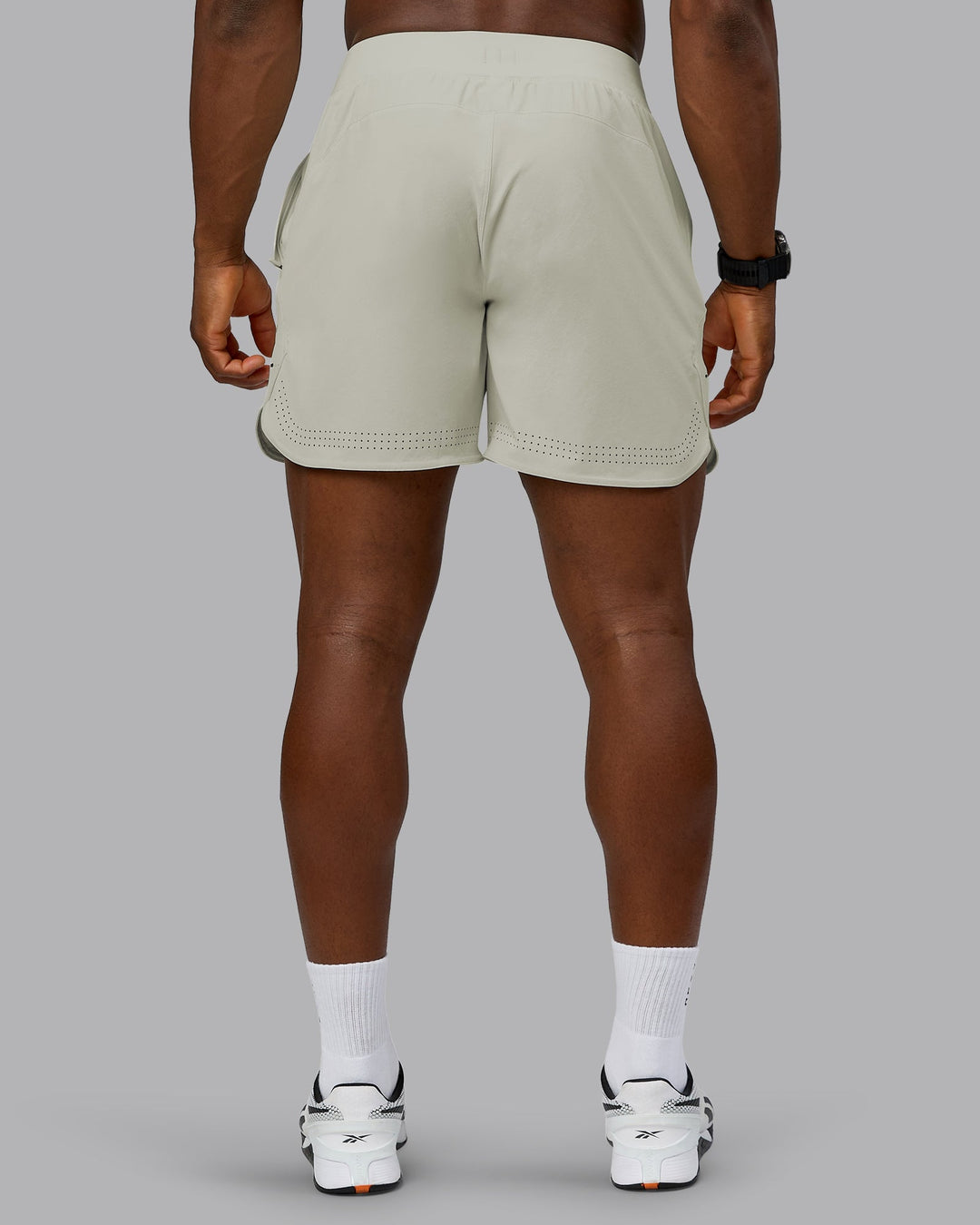 Man wearing Lift 6" Performance Short - Bone | Model:Sam | Size:L
