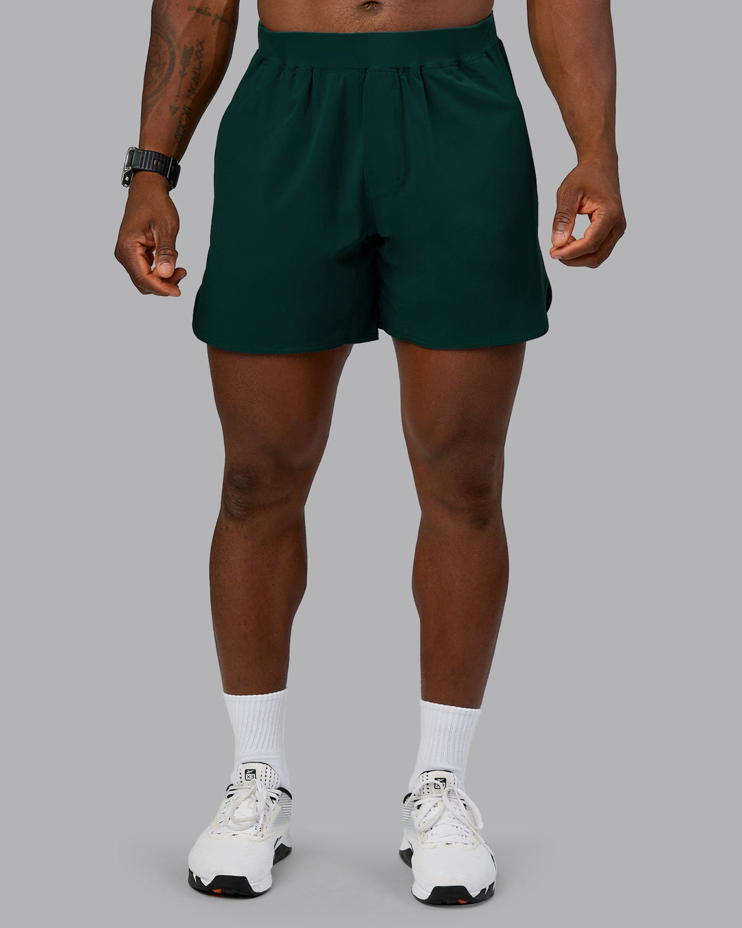 Man wearing Lift 6" Performance Short - Dark Moss | Model:Sam | Size:L