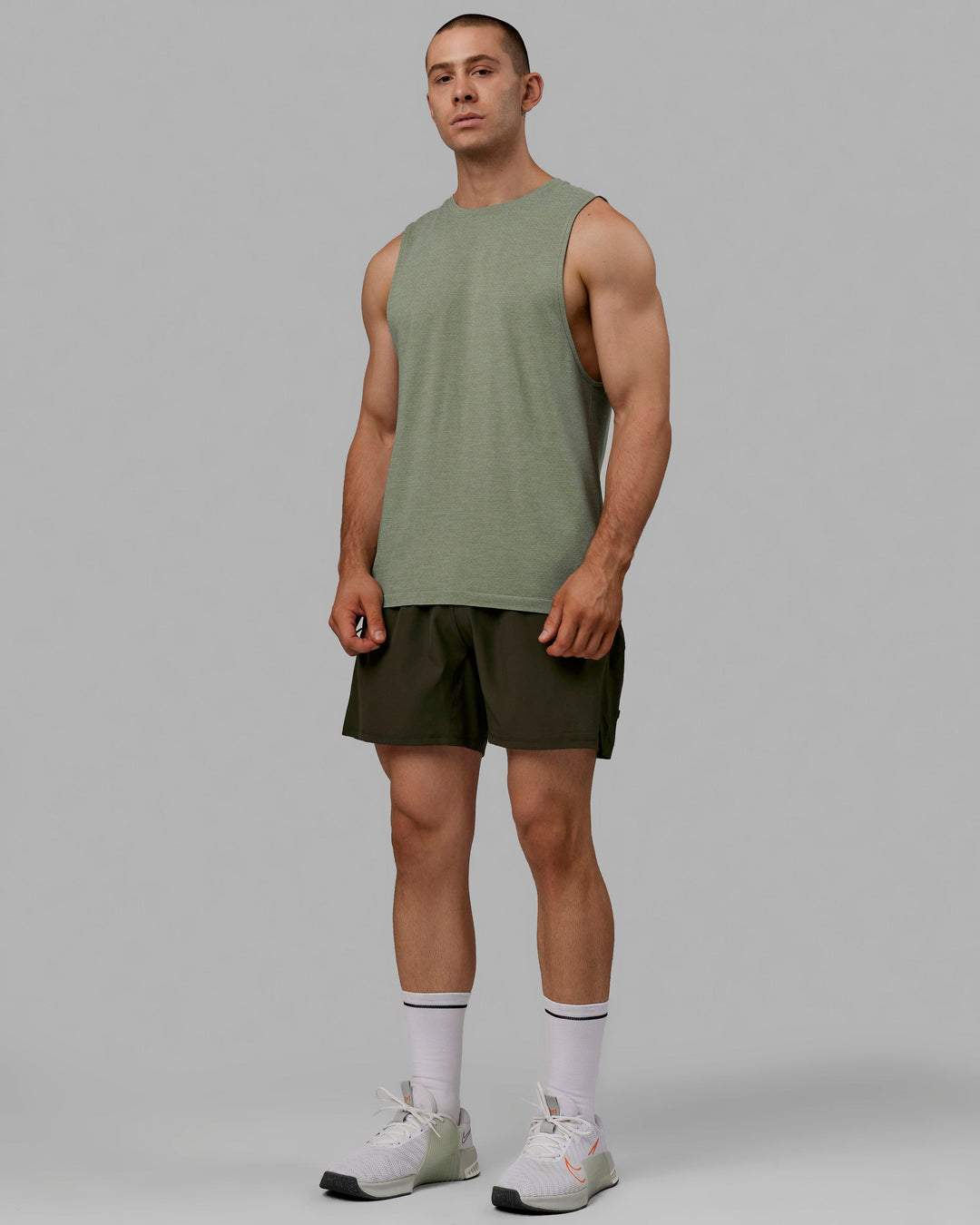 Man wearing AeroFLX+ Seamless Muscle Tank - Iceberg Green Marl