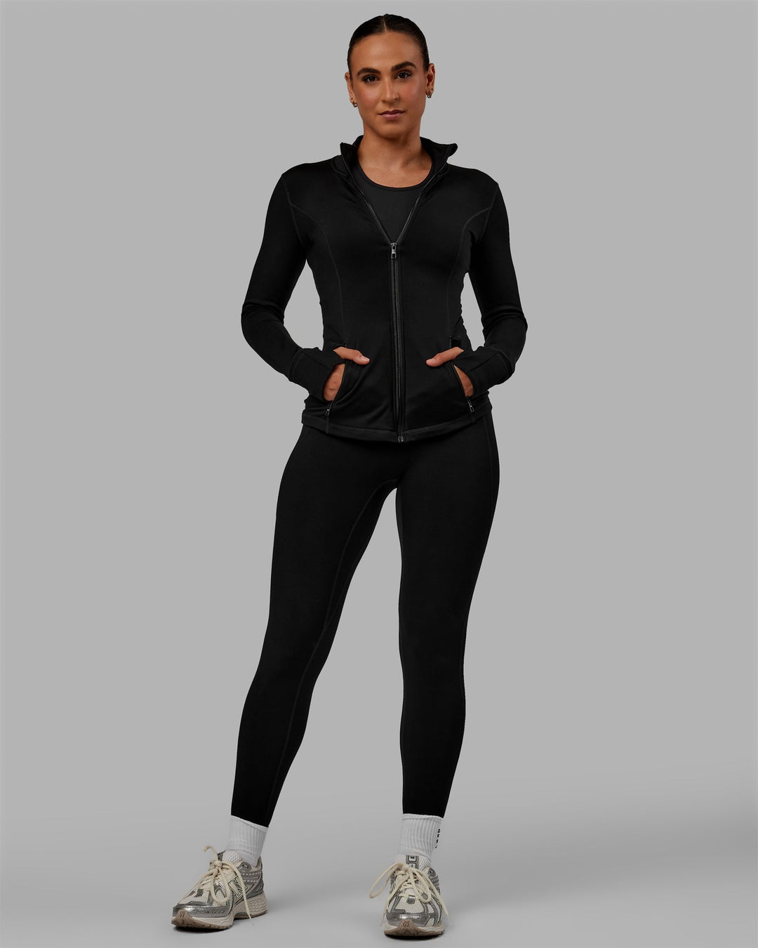 Woman wearing Motion Ultra High-Rise Thermal Full Length Legging - Black