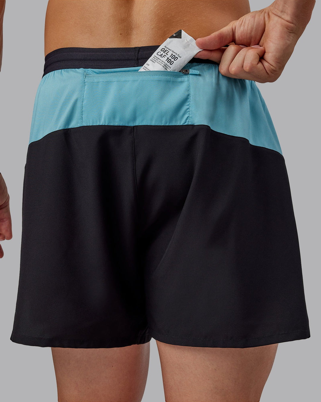 Man wearing Pace 5" Lined Performance Shorts - Black-Retro Blue