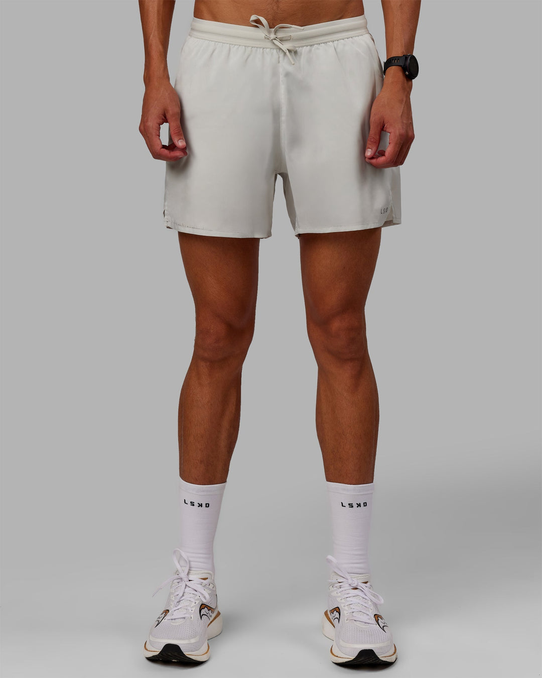 Man wearing Pace 5" Lined Performance Shorts - Digital Mist-Reflective