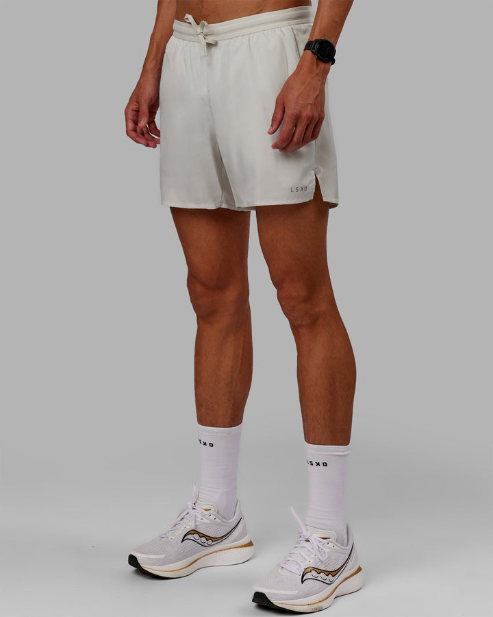 Man wearing Pace 5" Lined Performance Shorts - Digital Mist-Reflective