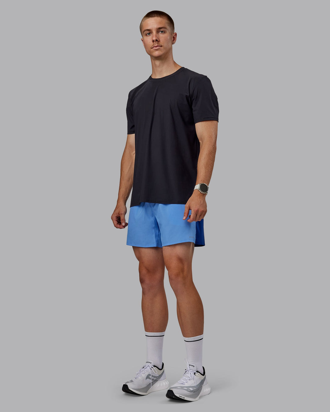 Man wearing Pace 5" Lined Performance Shorts - Midnight Blue-Ultramarine