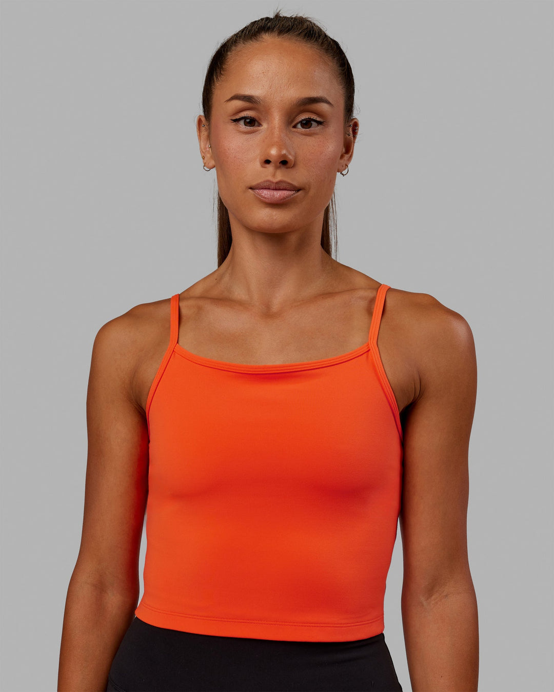 Woman wearing Rapid Active Tank - Ultra Orange