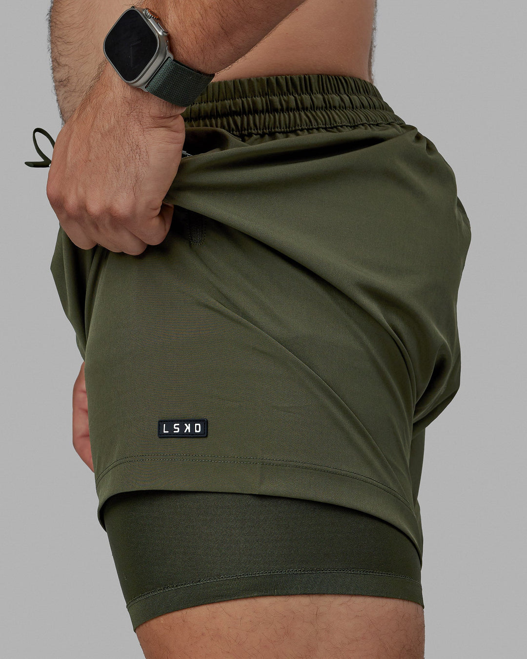 Man wearing Rep 5" Lined Performance Short - Forest Night