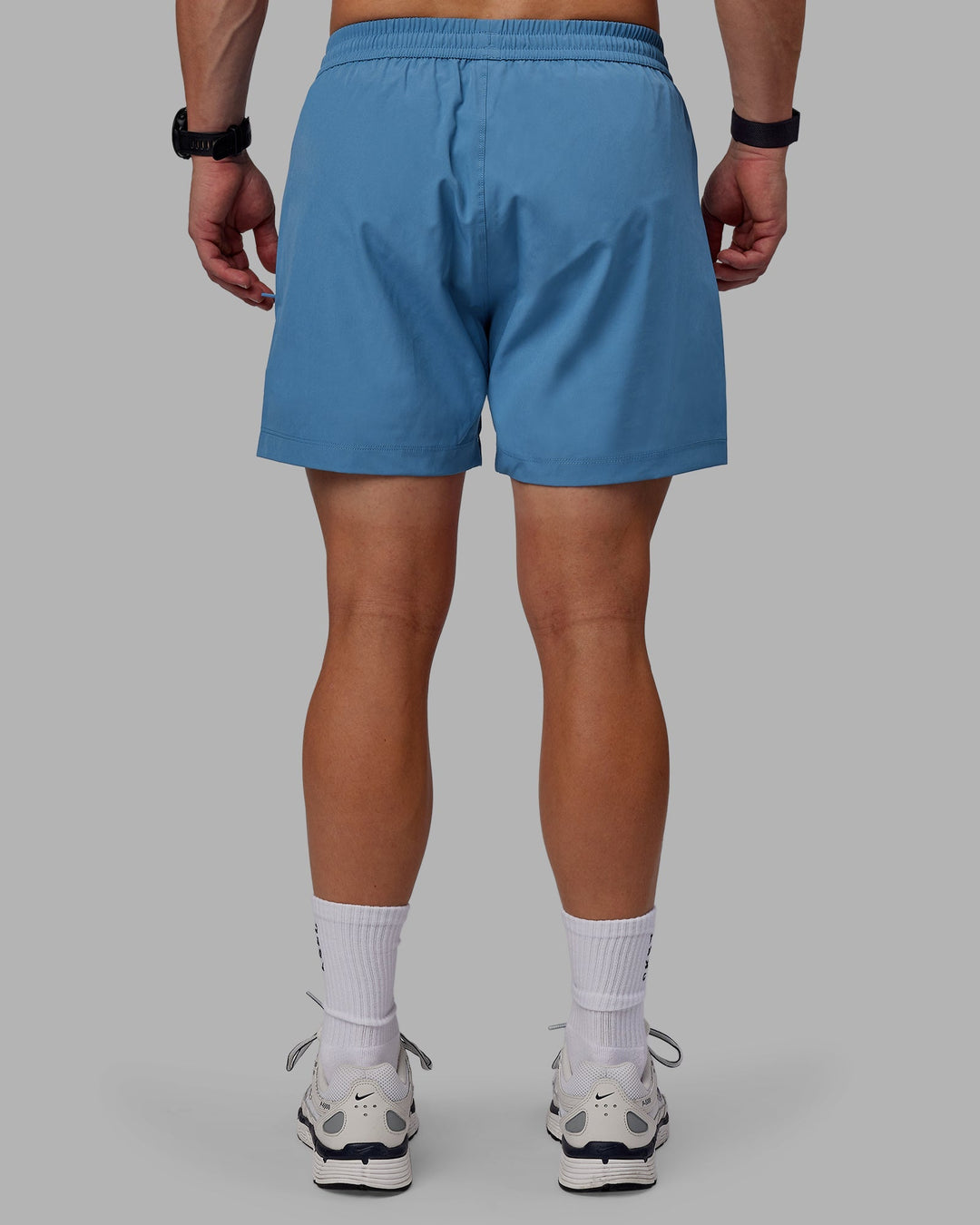 Man wearing Rep 5" Performance Shorts - Elemental Blue