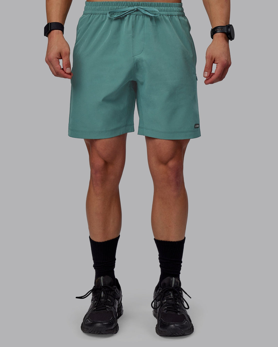 Man wearing Rep 7" Performance Shorts - Sage Bush