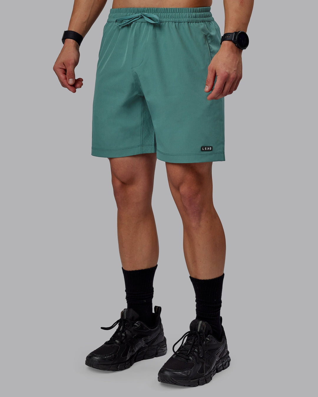 Man wearing Rep 7" Performance Shorts - Sage Bush