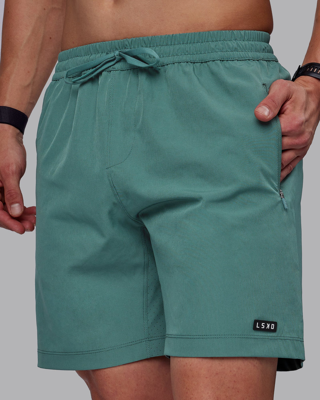 Man wearing Rep 7" Performance Shorts - Sage Bush