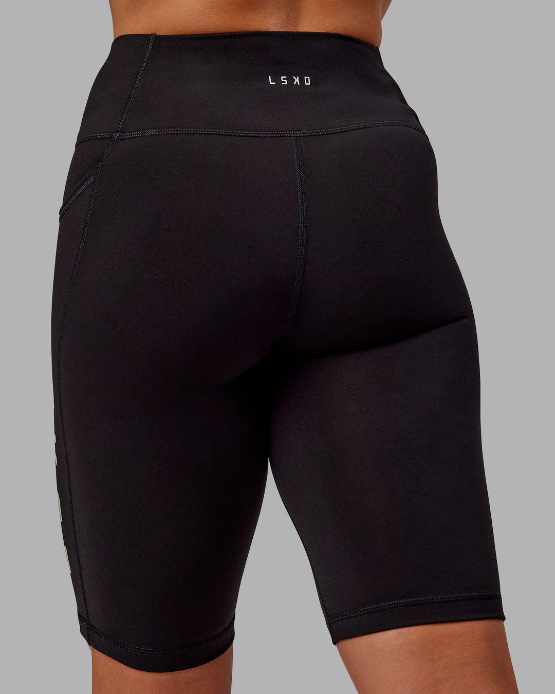 Woman wearing Rep Ultra High-Rise 9" Short Pockets - Black-Surreal Green