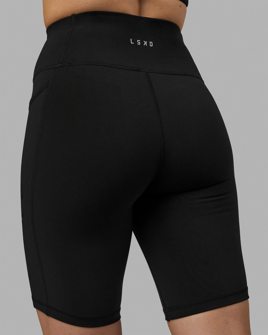 Woman wearing Rep Ultra High-Rise 9" Short Pockets - Black-Black