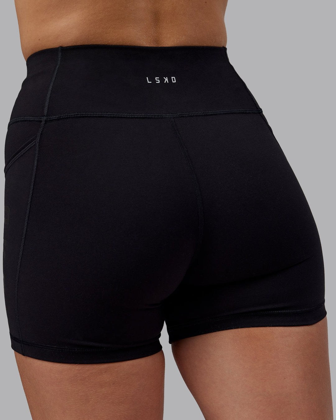 Woman wearing Rep Ultra High-Rise 4" Short Pockets - Black-Black