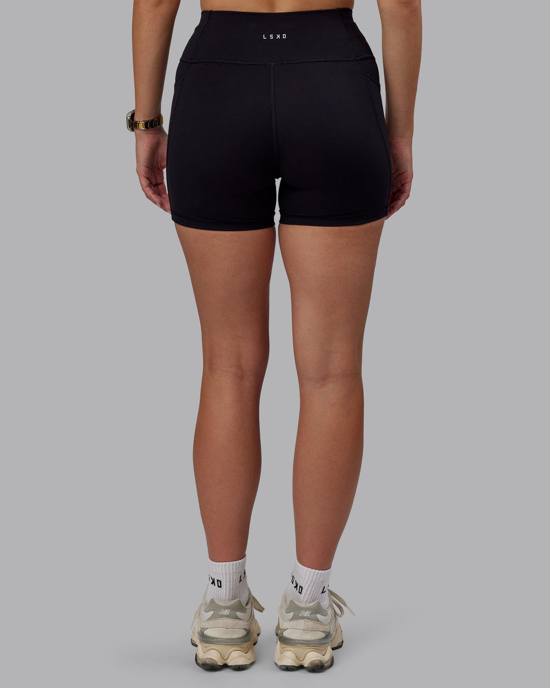 Woman wearing Rep Ultra High-Rise 4" Short Pockets - Black-Black