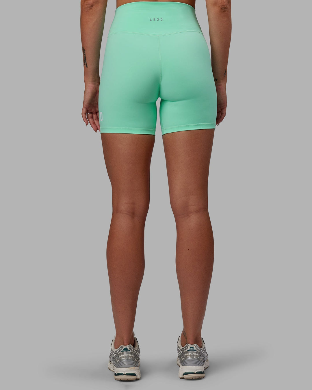 Woman wearing Shayna Jack Evolved Ultra High-Rise 6" Short - Ice Green-White