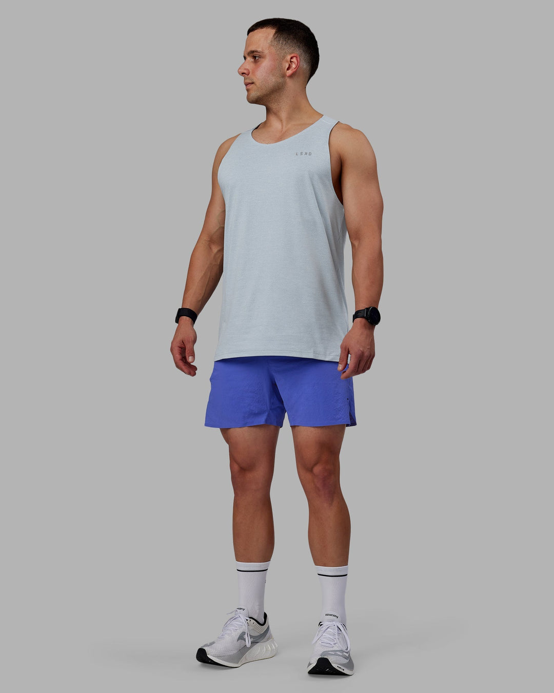 Man wearing UltraAir 5" Lined Performance Shorts - Baja Blue-Reflective