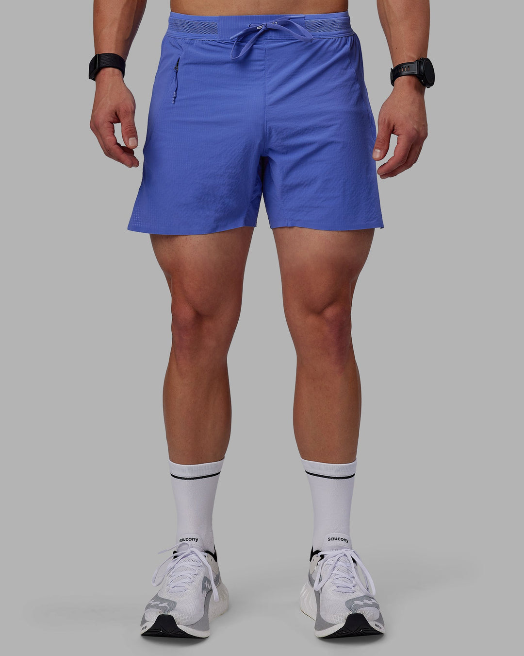 Man wearing UltraAir 5" Lined Performance Shorts - Baja Blue-Reflective