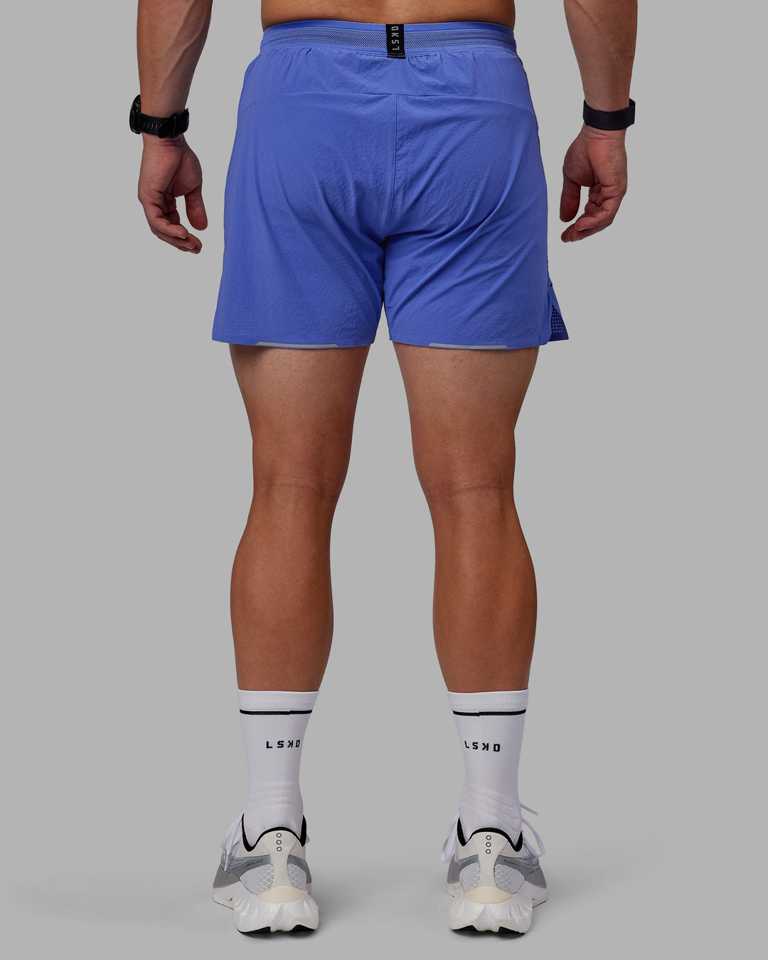 Man wearing UltraAir 5" Lined Performance Shorts - Baja Blue-Reflective