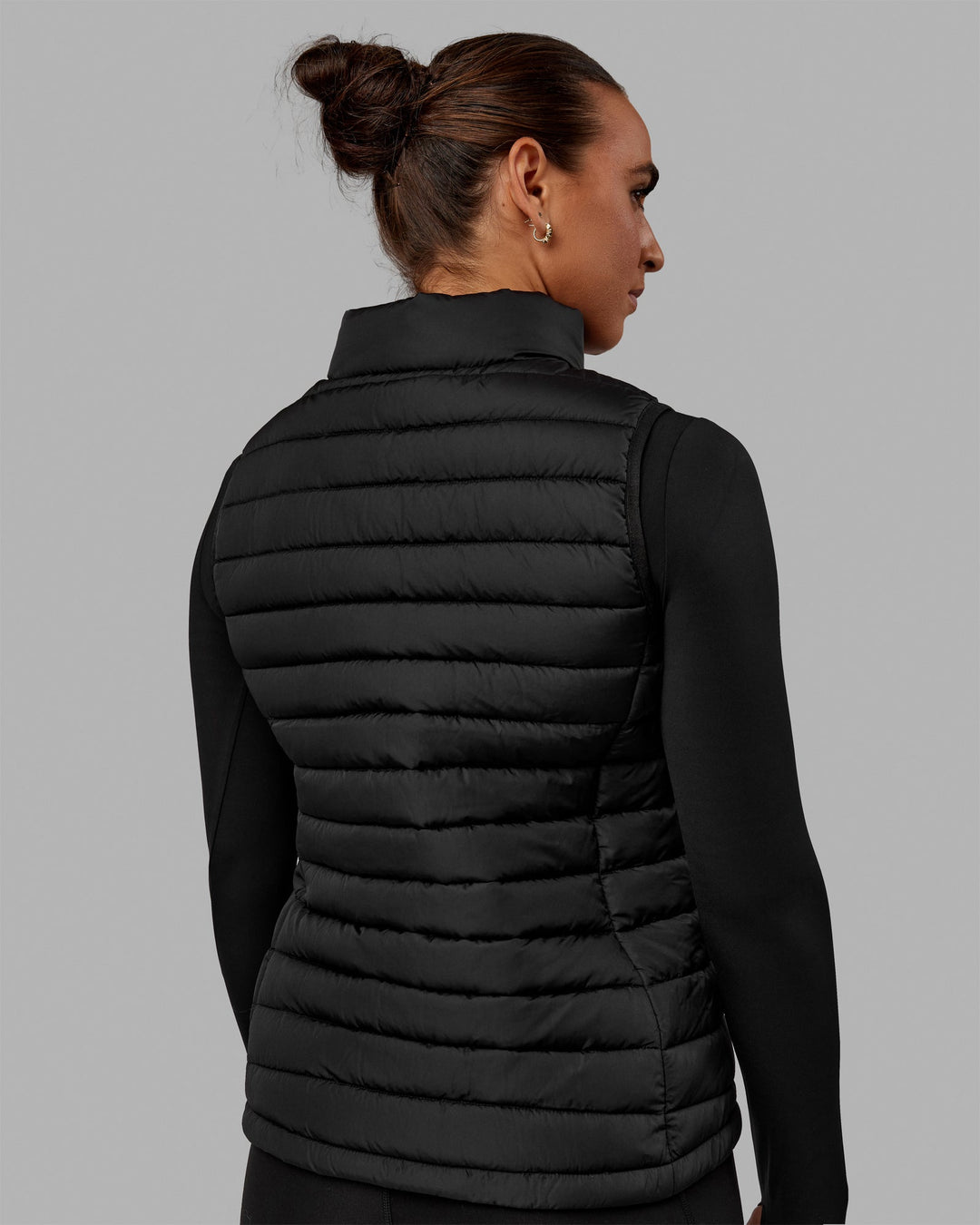 Woman wearing All Day Puffer Vest - Black