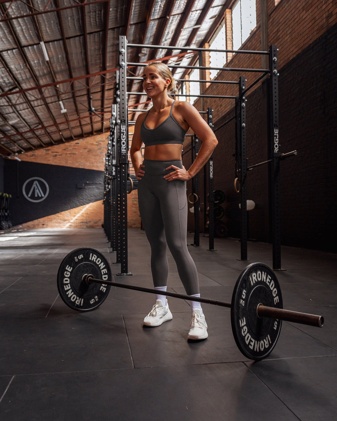 Woman wearing Elite High-Rise 7/8 Legging Pockets - Dark Storm | Size:S