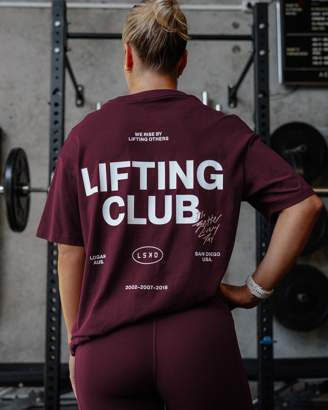Woman wearing Lifting Club FLXCotton Tee Oversize - Cherry Lacquer-White | Model:Lyss | Size:S