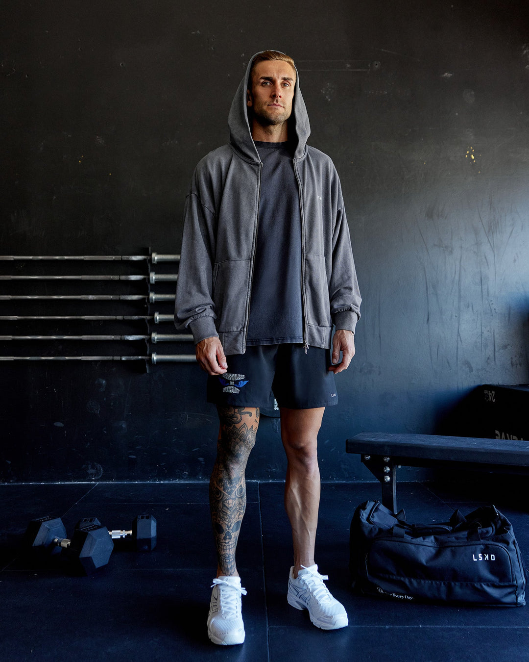 Man wearing Relentless Washed Zip Through Oversized Hoodie - Dark Storm-White | Model:Tommy | Size:S