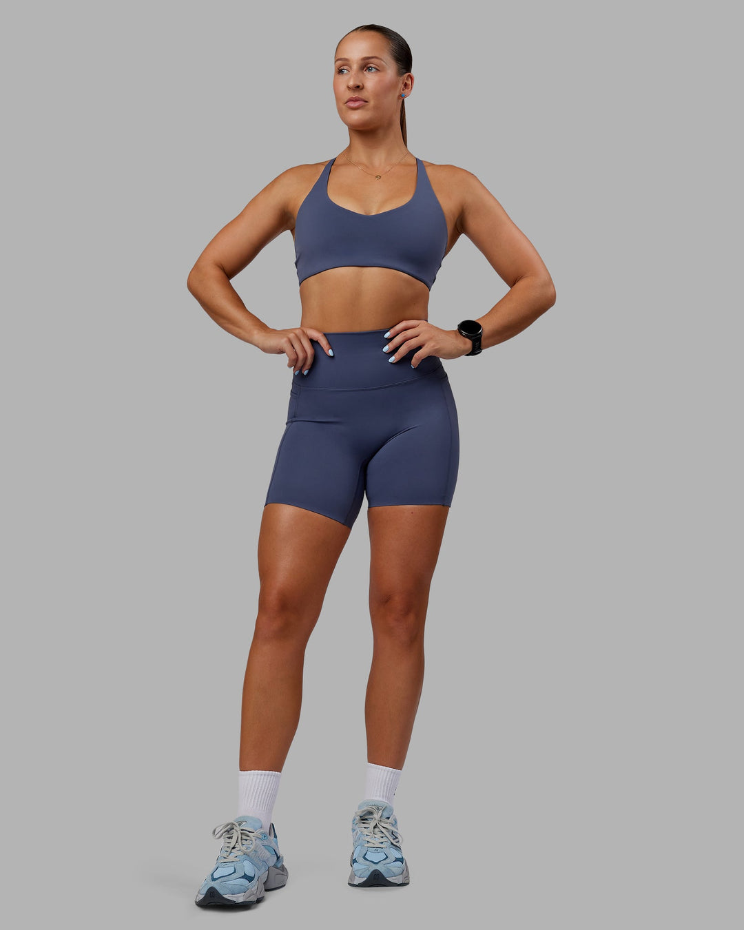 Woman wearing Abs Elixir Ultra High-Rise 6" Short Pockets - Nightshadow Blue