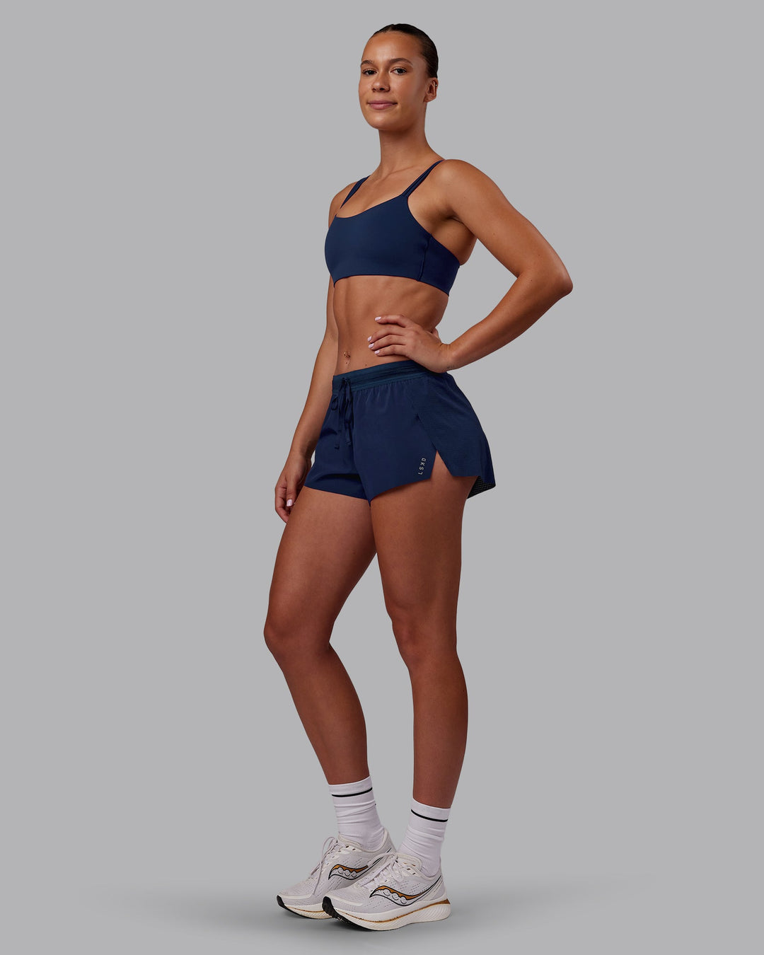 Woman wearing Accelerate 3" Running Short - Future Navy | Model:Charlize | Size:S