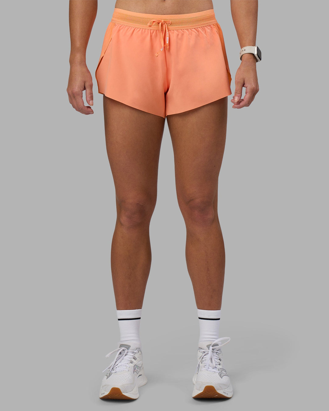 Woman wearing Accelerate 3" Running Short - Cantaloupe | Model:Hannah | Size:S