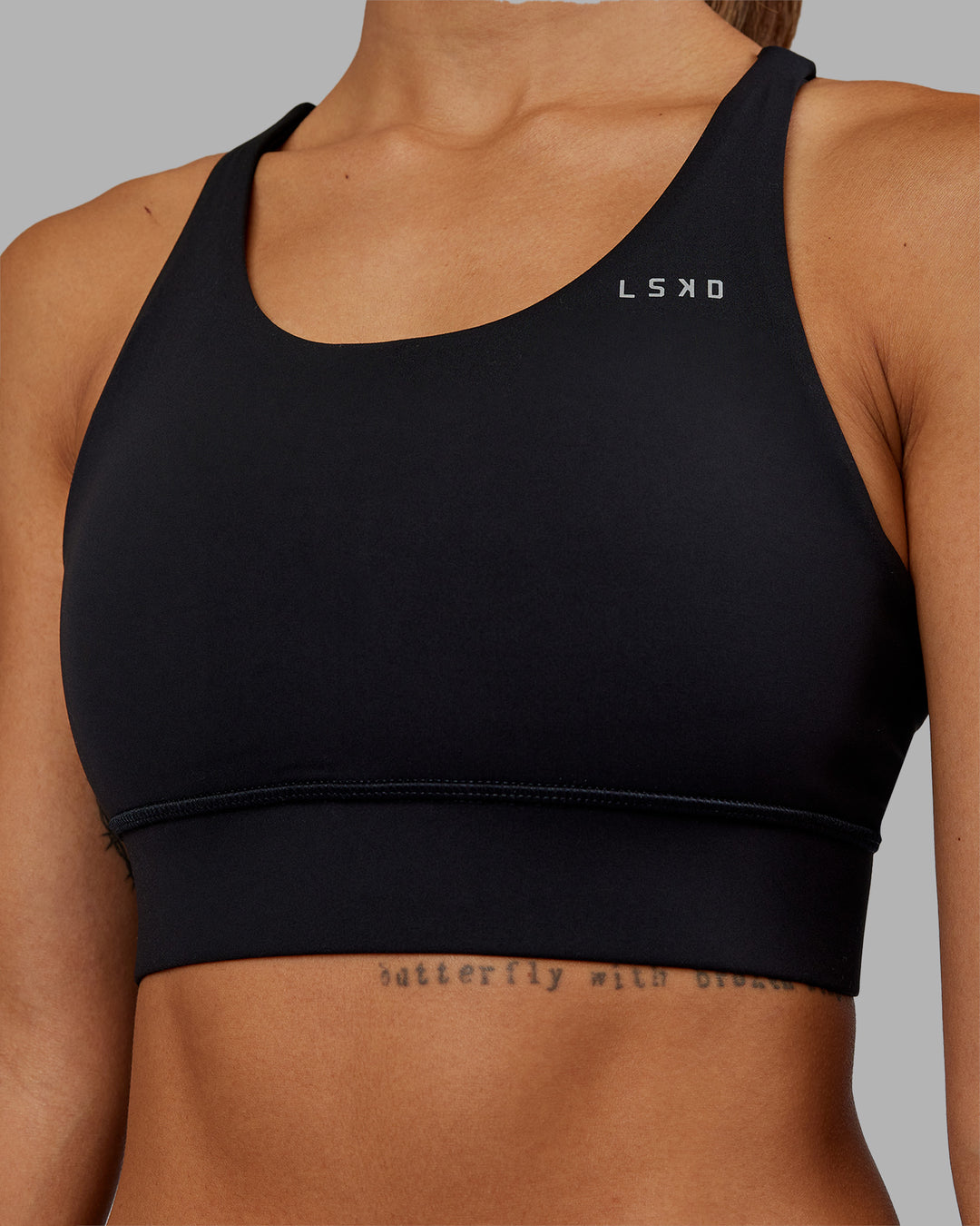 Woman wearing Accelerate Sports Bra - Black | Model:Vanessa | Size:S