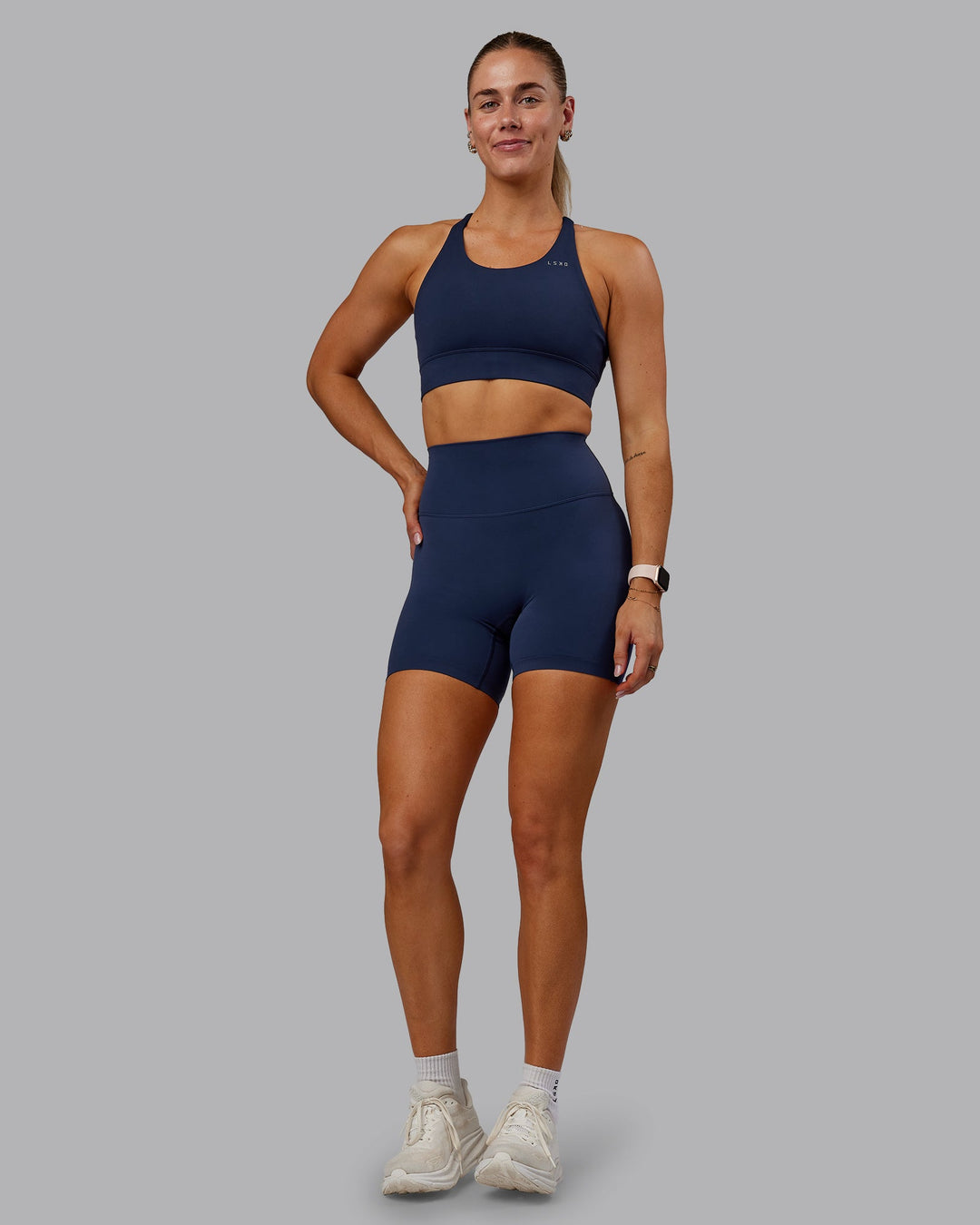 Woman wearing Accelerate Sports Bra in Future Navy | Model:Hannah | Size:S