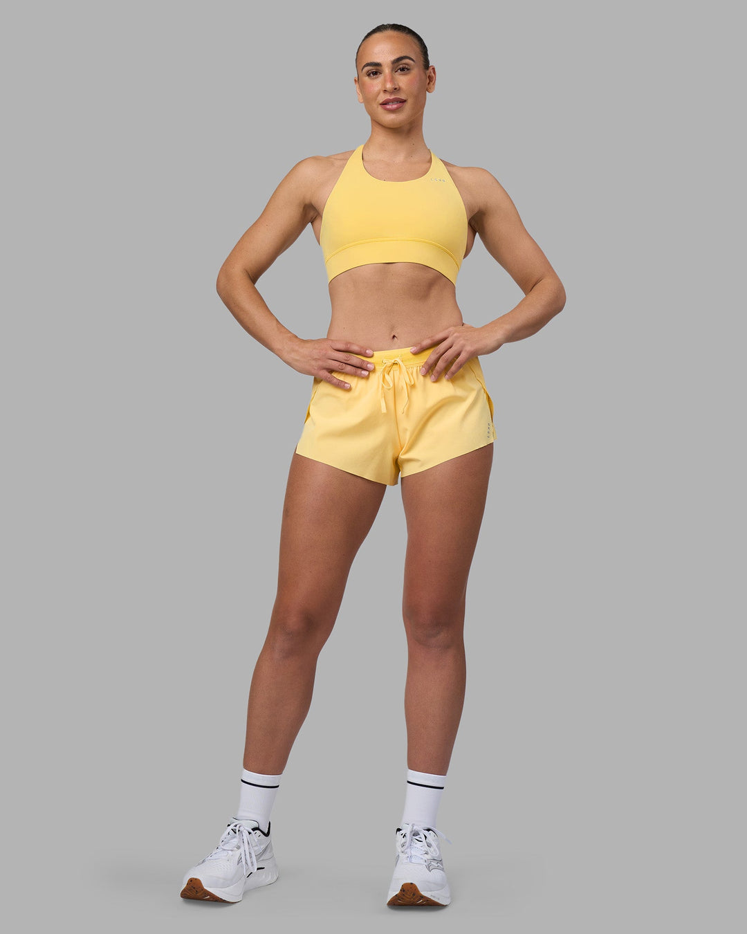 Woman wearing Accelerate Sports Bra - Lemon | Model:Sophie | Size:S