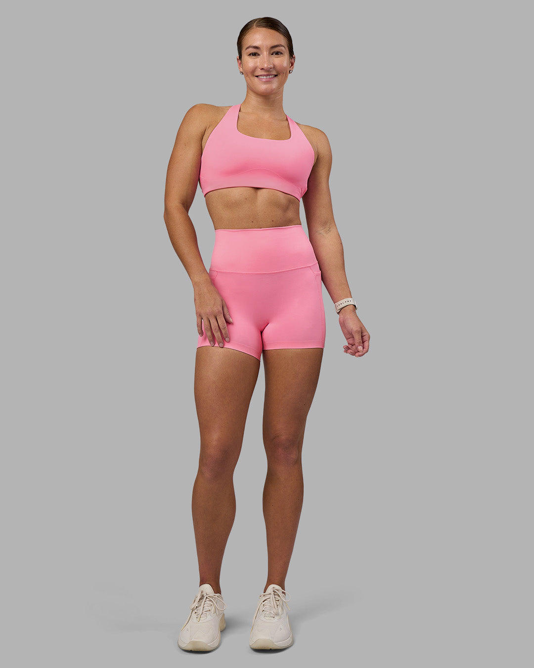 Woman wearing Aspire Sports Bra - Candy Pink | Model:Hannah | Size:S