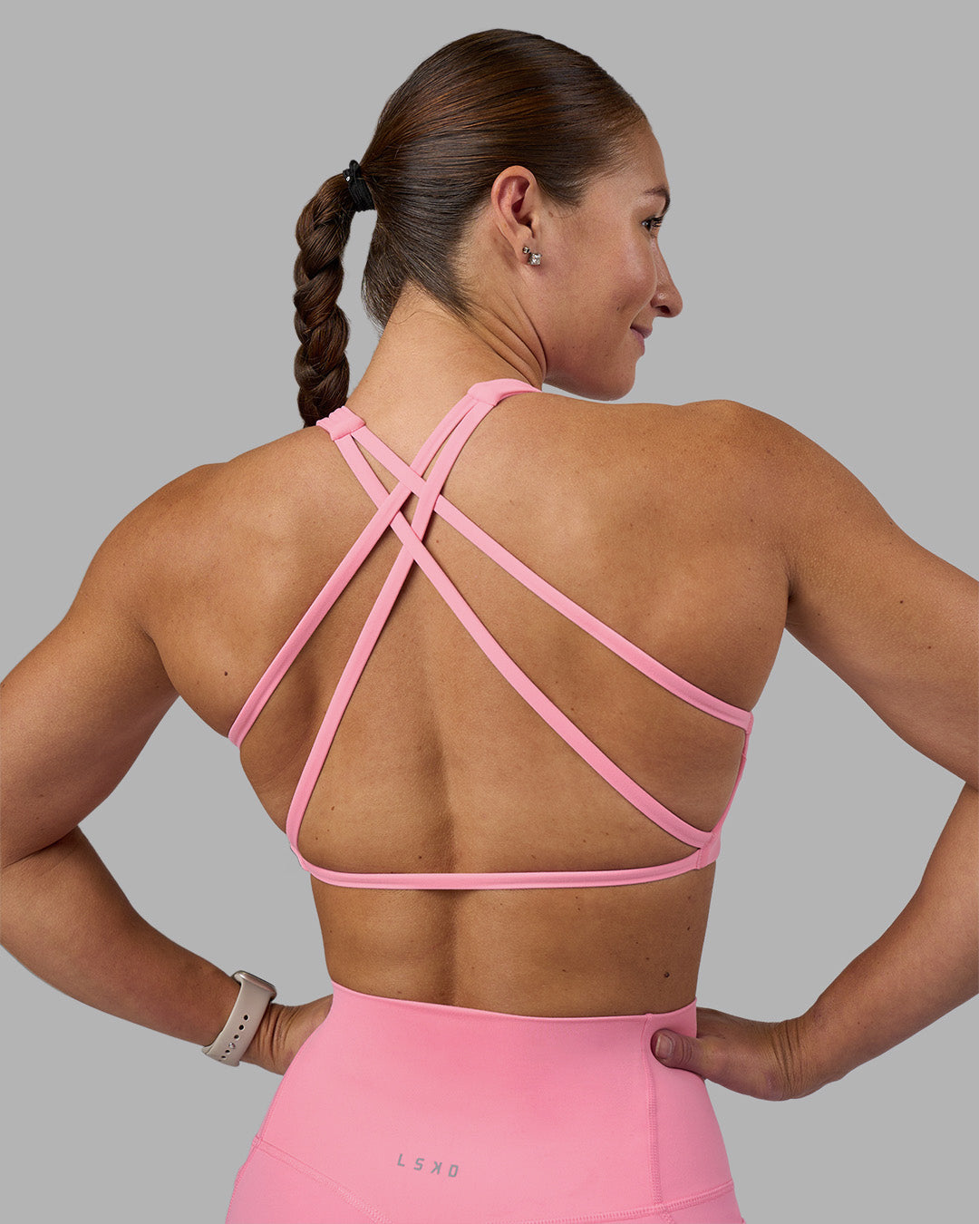 Woman wearing Aspire Sports Bra - Candy Pink | Model:Hannah | Size:S