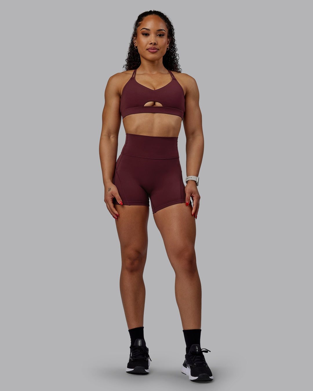Woman wearing Bend Ultra High-Rise 4" Short - Dark Cherry