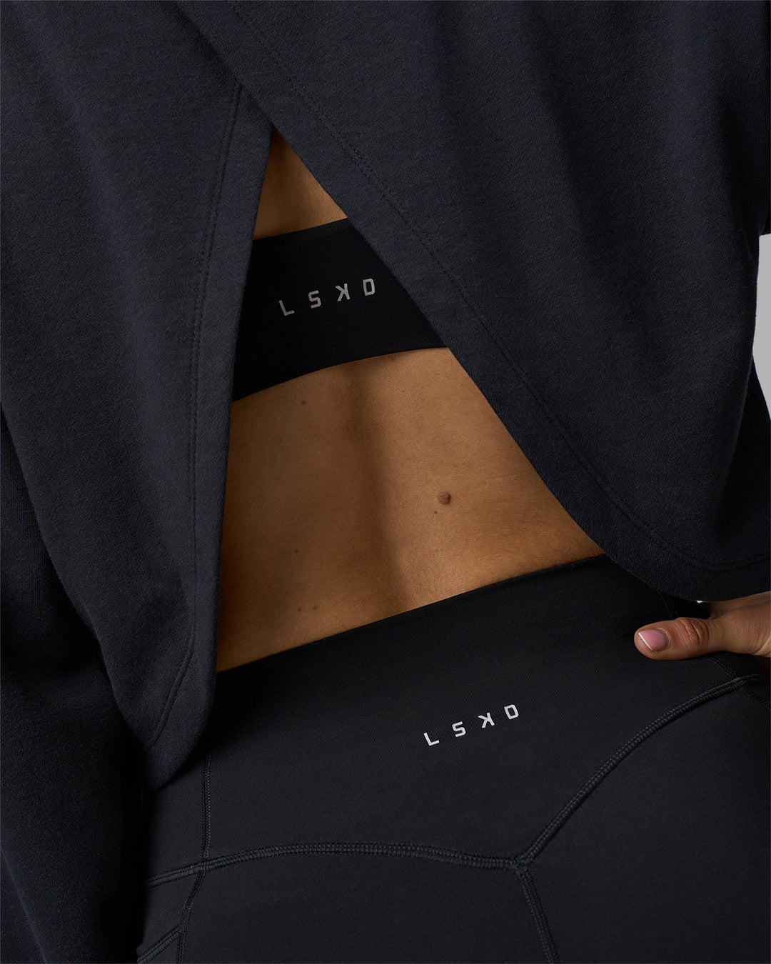 Woman wearing Breeze Open Back Sweater - Black-Black | Model:Phoebe | Size:S