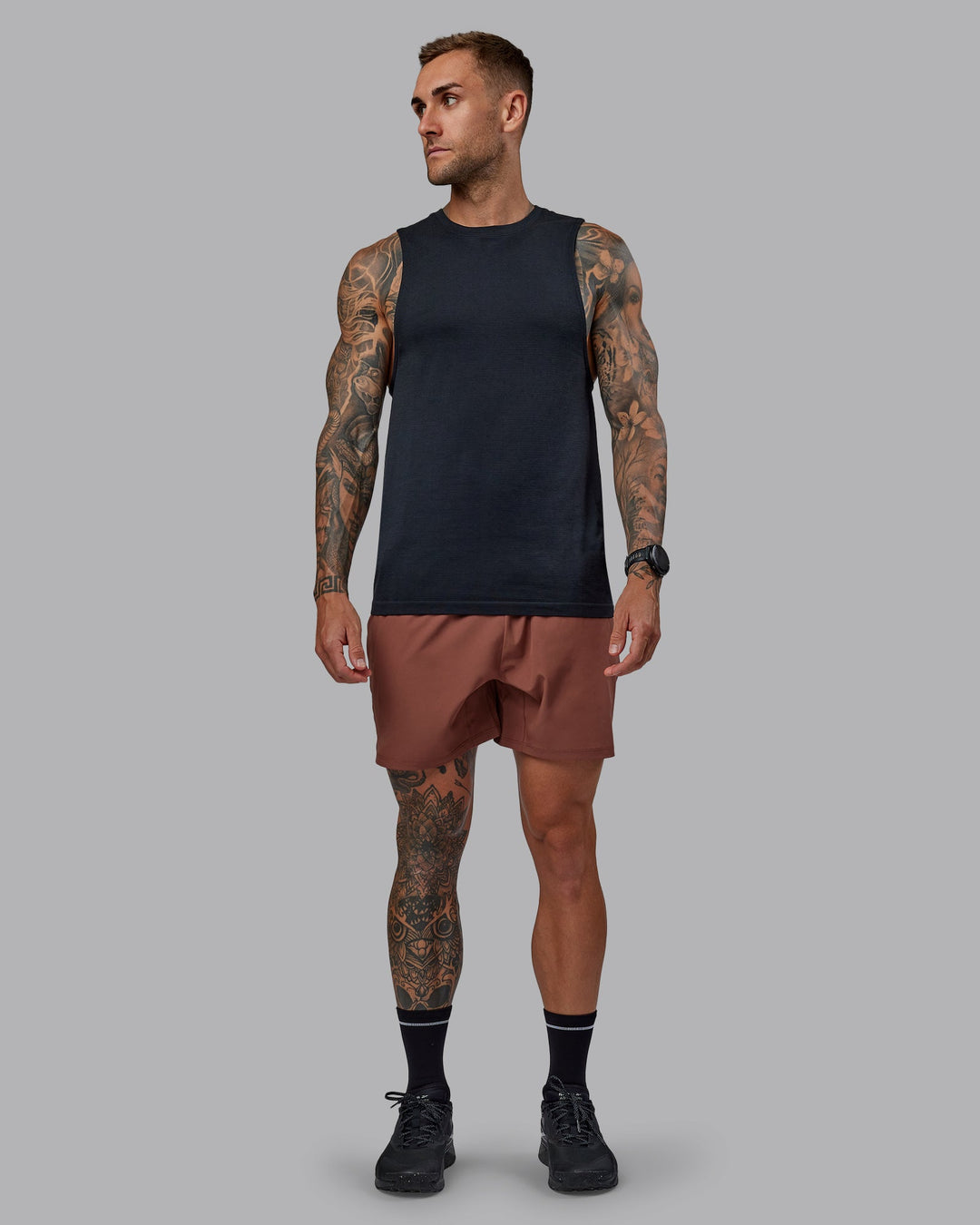 Man wearing Challenger 6" Performance Short in Mahogany | Size:S