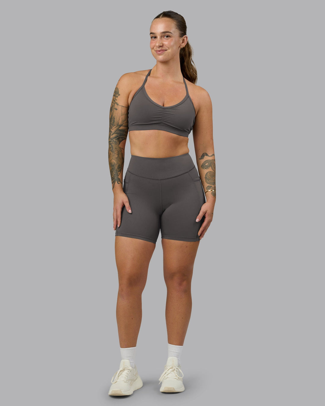 Woman wearing Elite High-Rise 6" Short Pockets - Dark Storm | Model:Robyn | Size:S