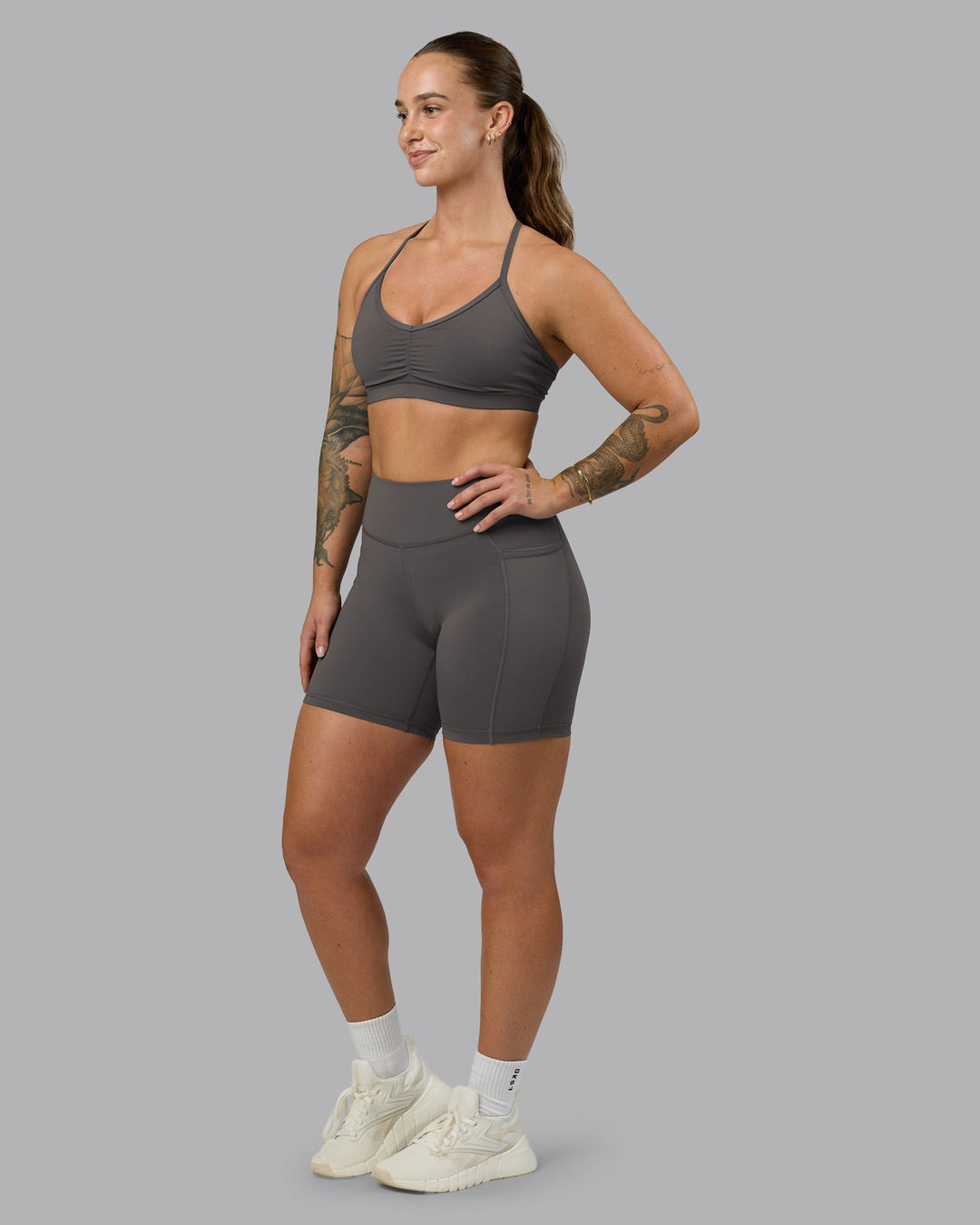 Woman wearing Elite High-Rise 6" Short Pockets - Dark Storm | Model:Robyn | Size:S