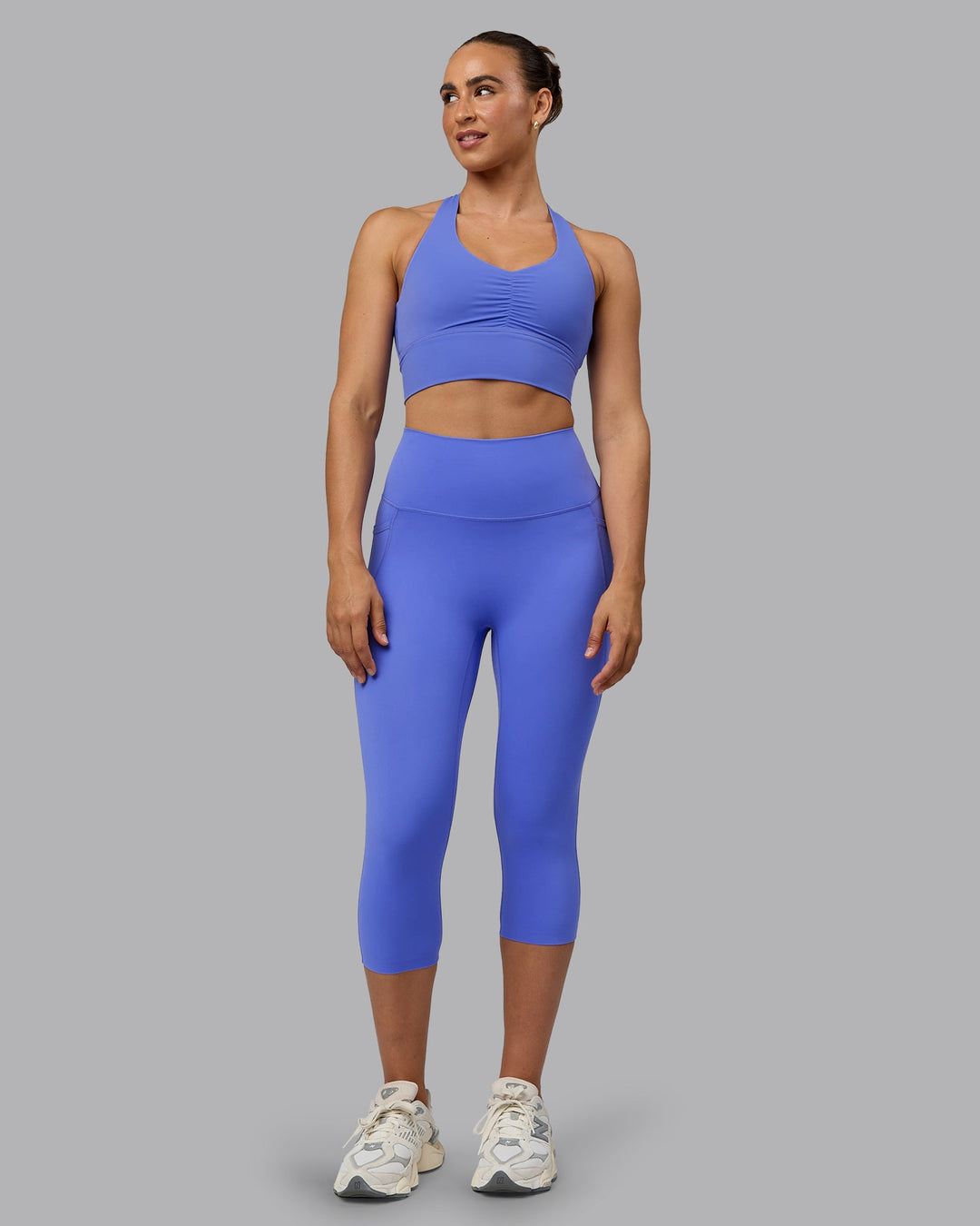 Woman wearing Elixir Ultra High-Rise 3/4 Legging Pockets - Baja Blue | Model:Sophie | Size:S