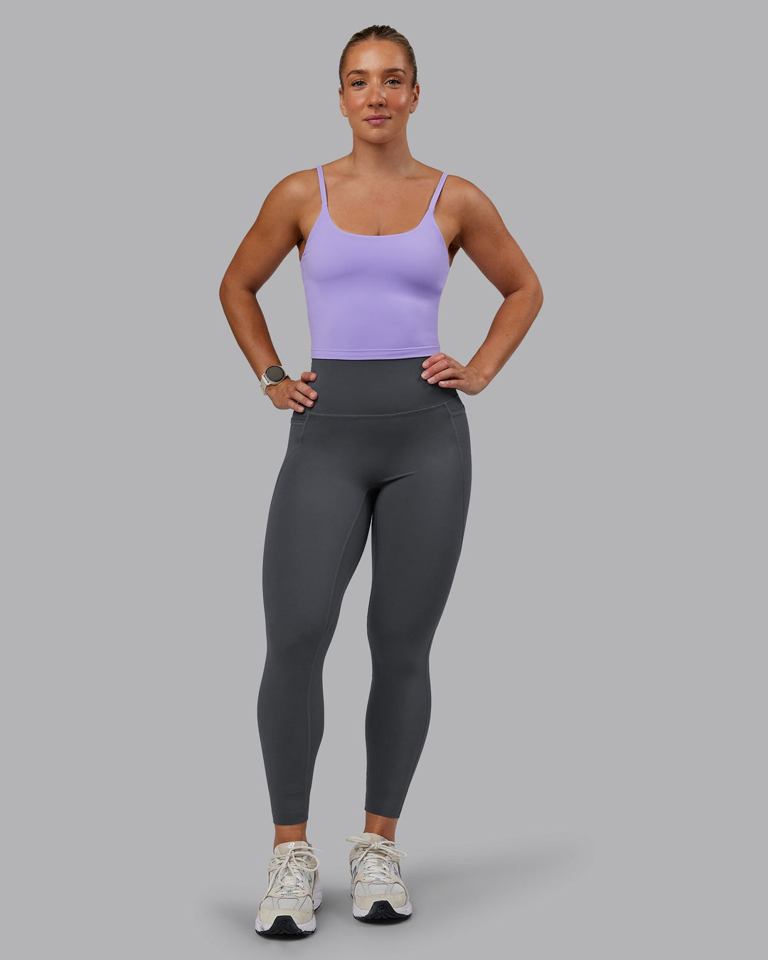 Woman wearing Elixir Ultra High-Rise 7/8 Legging Pockets in Dark Storm | Size:S