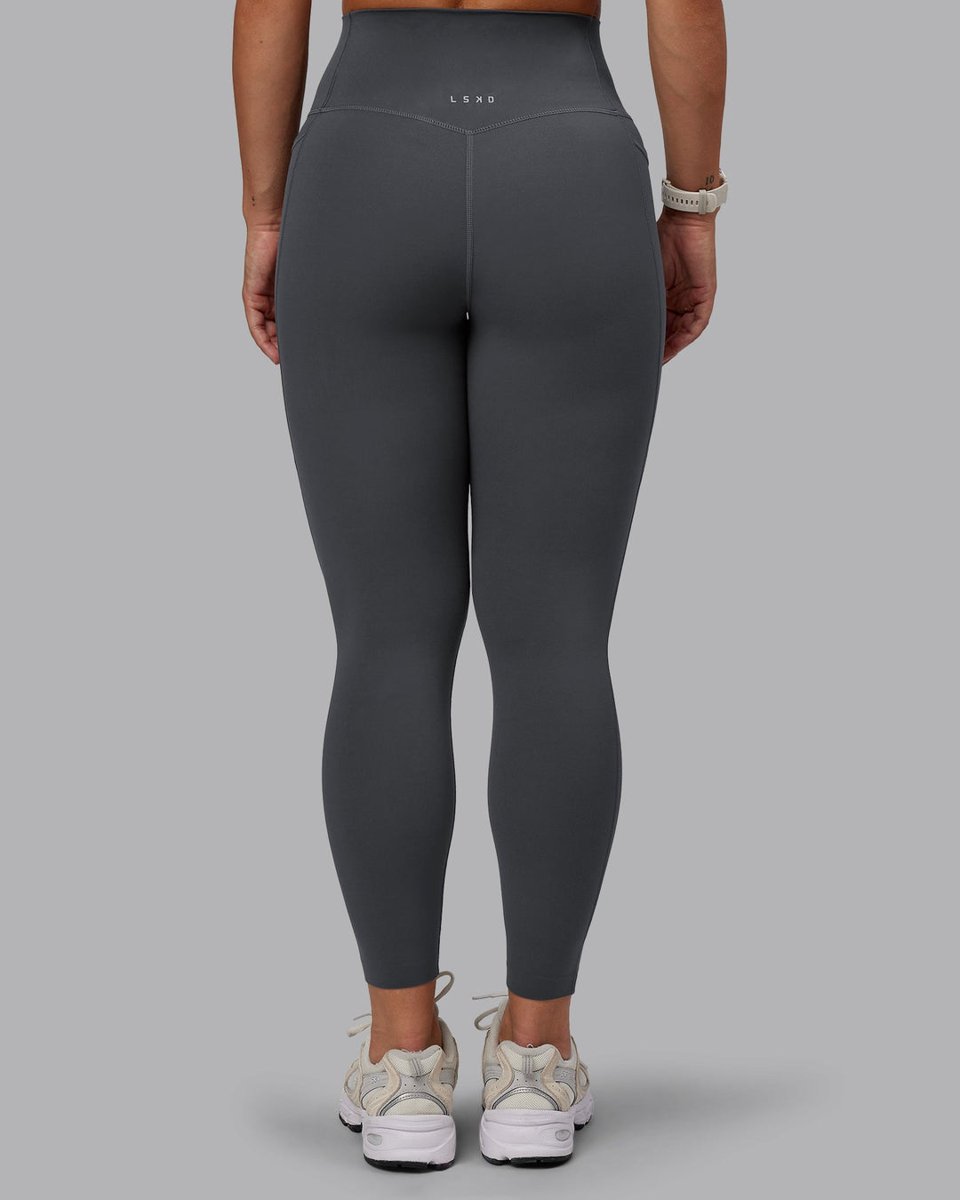 Woman wearing Elixir Ultra High-Rise 7/8 Legging Pockets in Dark Storm | Size:S