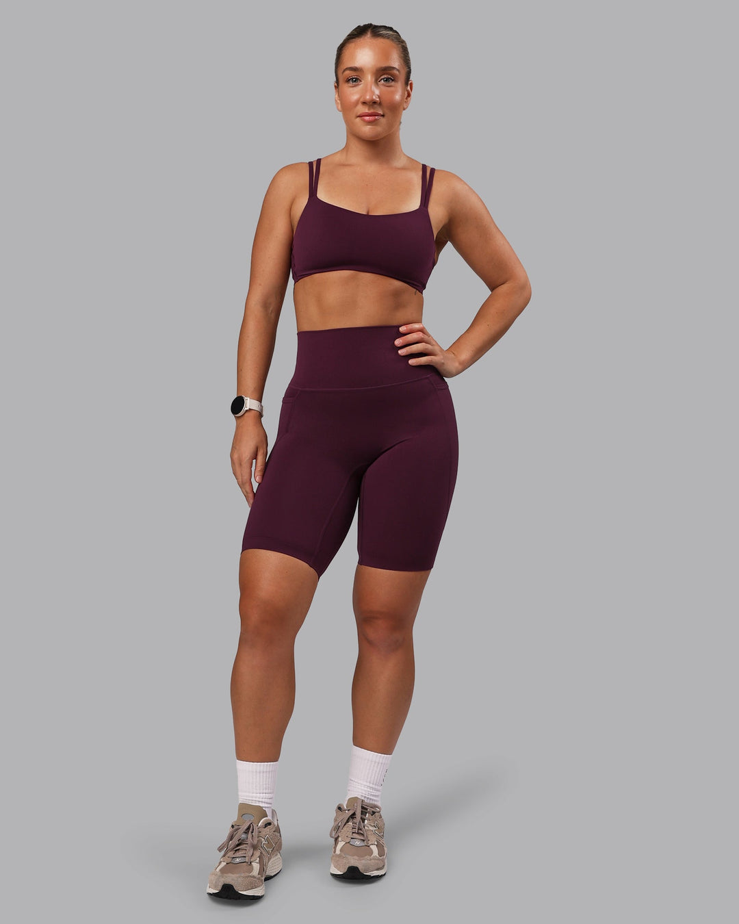 Woman wearing Elixir Ultra High-Rise 9" Short Pockets - Cherry Lacquer