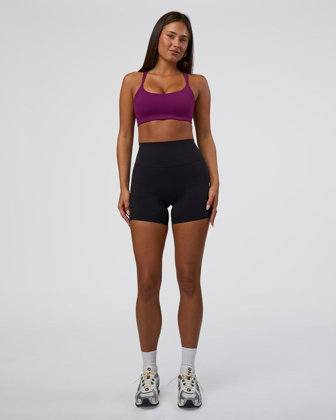 Woman wearing Elixir Defined High-Rise 6" Short Pockets - Black | Model:Bianca | Size:S