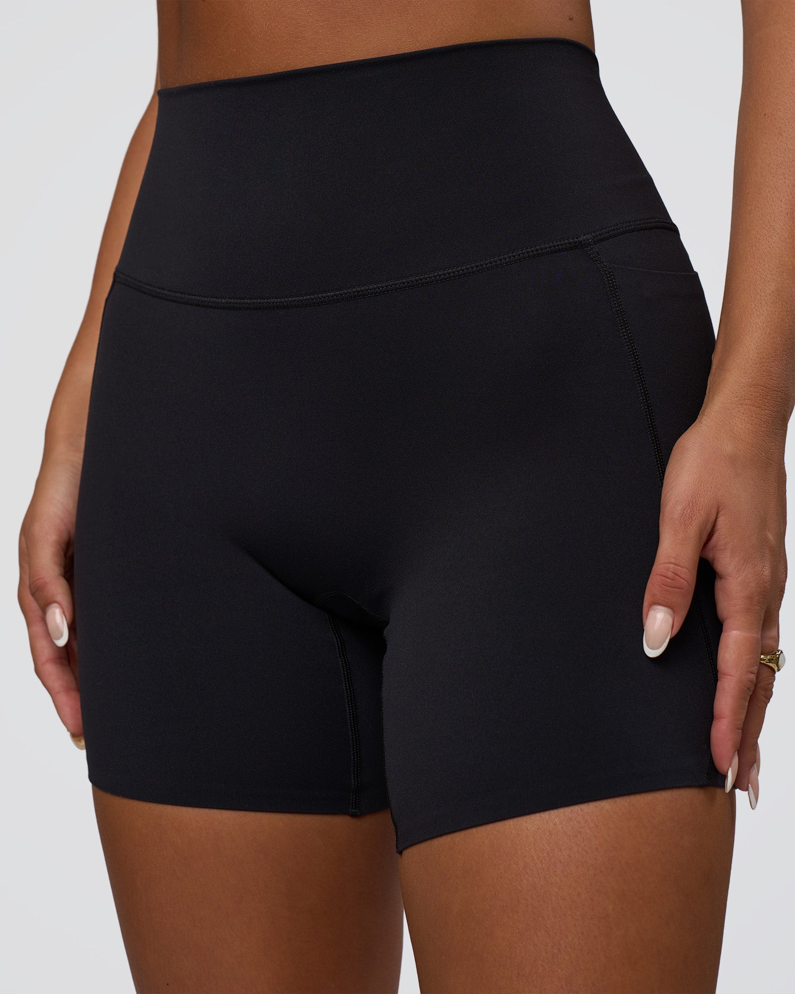 Woman wearing Elixir Defined High-Rise 6" Short Pockets - Black | Model:Bianca | Size:S