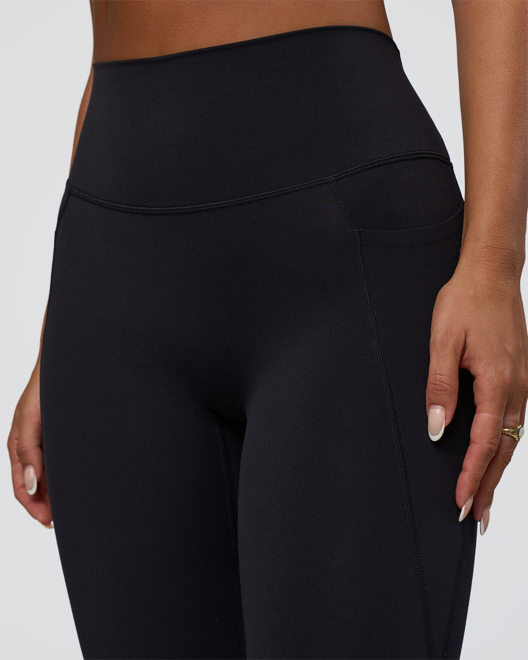 Woman wearing Elixir Defined High-Rise Full Length Legging Pockets - Black | Model:Bianca | Size:S