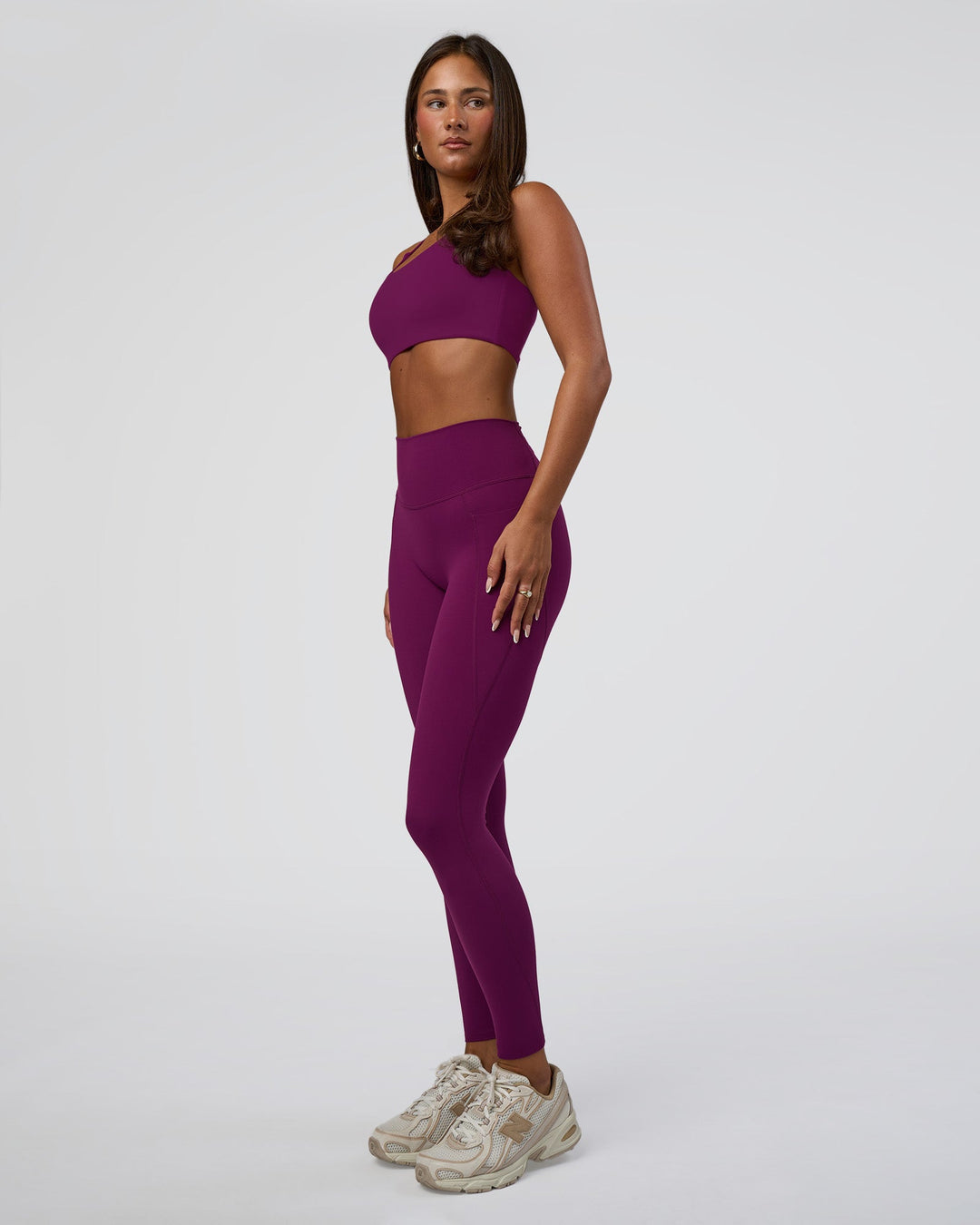 Woman wearing Elixir Defined High-Rise Full Length Legging Pockets - Plum Caspia | Model:Bianca | Size:S