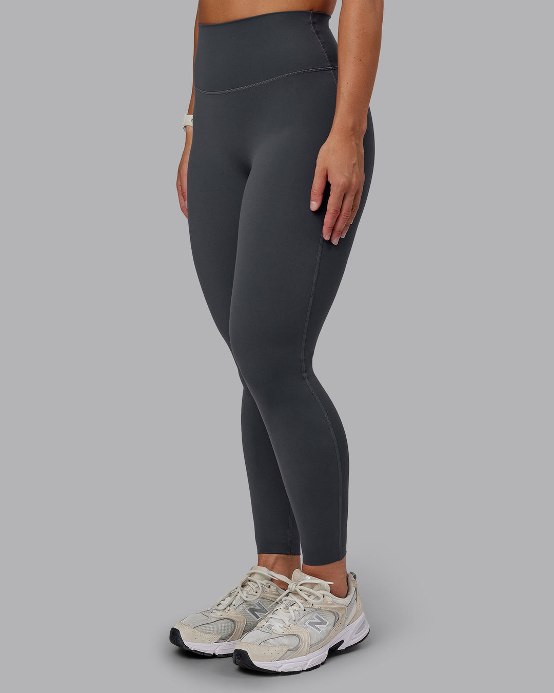 Woman wearing Elixir Ultra High-Rise Full Length Leggings in Dark Storm | Size:S